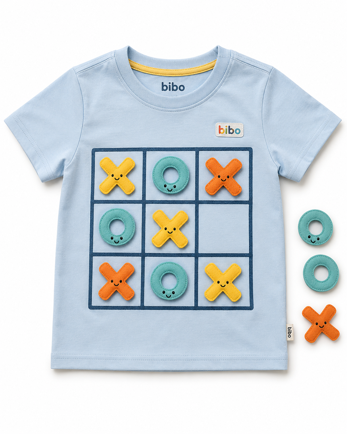 Child wearing the Bibo Play Tee with Tic-Tac-Toe Play Shirt pieces attached